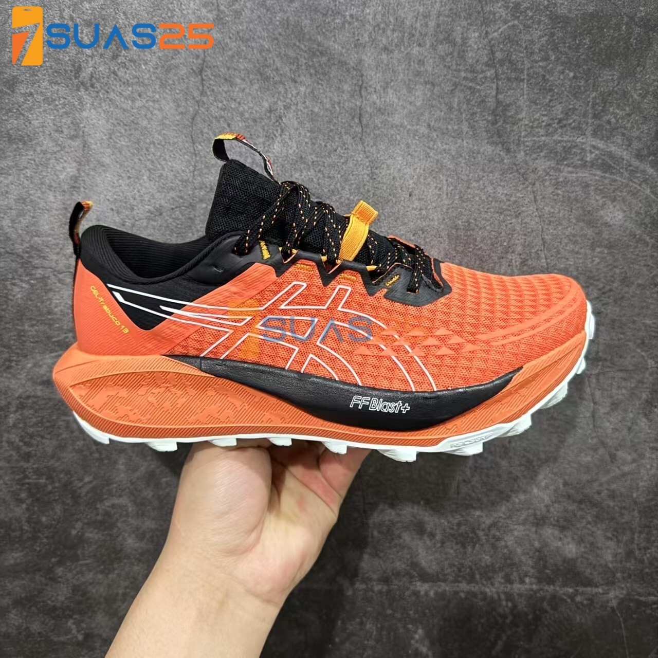 ASICS Gel Trabuco 13 orange/black colorway.